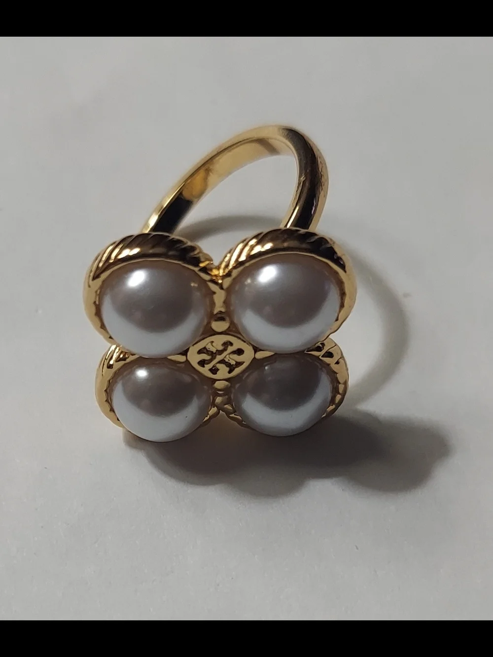 Tory Burch Rope Clover ring featuring four faux pearls set in gold-tone metal